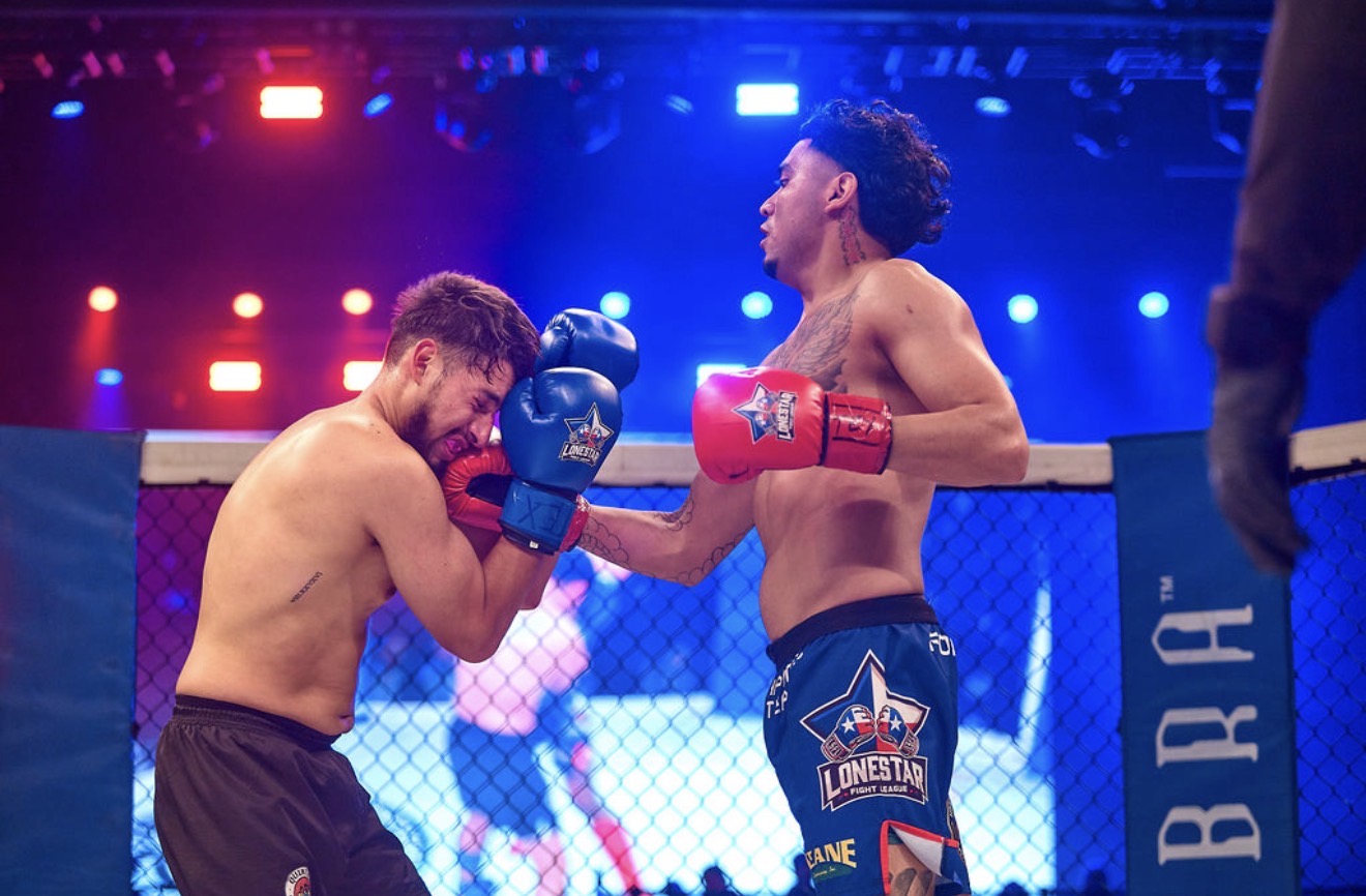 Fighter lands punch inside the cage